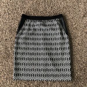 White with black design mini skirt with faux leather detail